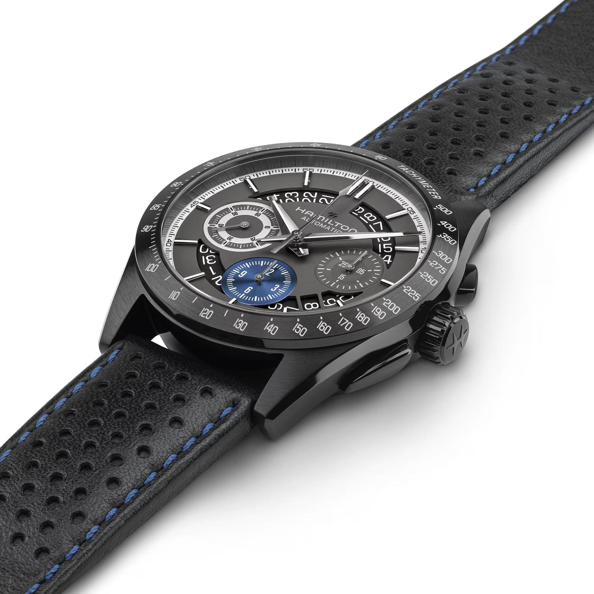 The Hamilton Jazzmaster Performer Auto Chrono 42mm Watch by Hamilton Watch features a black perforated leather strap with blue stitching, H-31 movement, three subdials (one in blue), and white hour markers.
