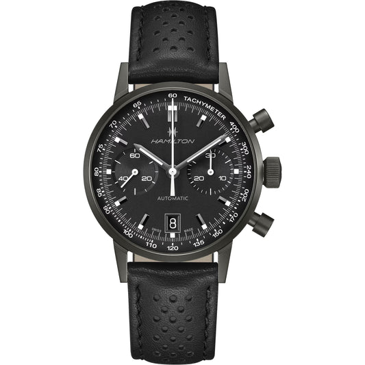 The Hamilton American Classic Intra-matic Auto Chrono 40mm by Hamilton Watch is a vintage-inspired timepiece with three subdials, racing-style tachymeter, date at 6 o’clock, and a perforated black leather strap with white accents.