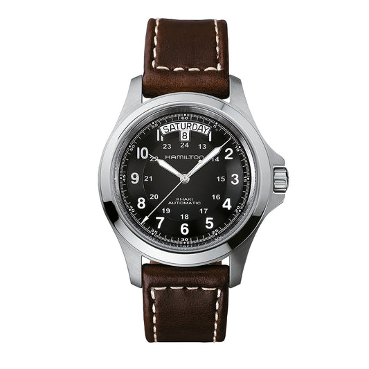 The Hamilton Khaki Field King Auto 40mm Watch comes with a silver case, a brown leather strap, and a black dial featuring white Arabic numerals. It includes military time functionality and displays the day-date as "Saturday 8." With an impressive 80-hour power reserve, the dial elegantly showcases the Hamilton Watch brand name.