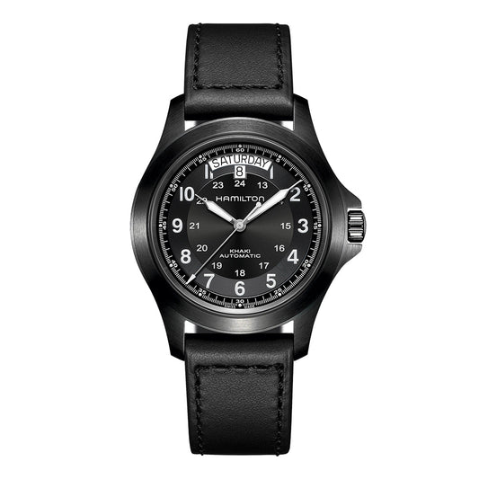 The Hamilton Khaki Field King Auto 40mm Watch includes a black PVD-coated case paired with a leather strap. It showcases a circular dial with white numerals and features a day-date display at the top, along with the Hamilton Watch brand name prominently displayed below the date. This timepiece merges classic design with an 80-hour power reserve for enhanced reliability.