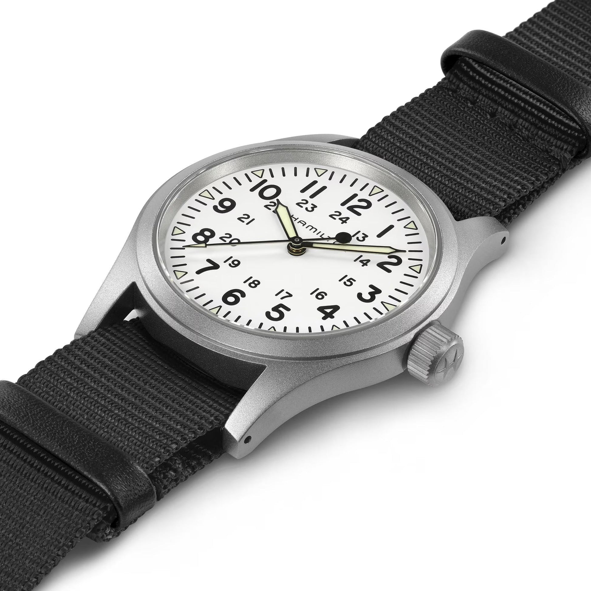 The Hamilton Khaki Field Mechanical 38mm Watch by Hamilton Watch features a silver stainless steel case, white dial with black Arabic numerals (12/24-hour), black hands, and a durable NATO strap for a striking presentation.