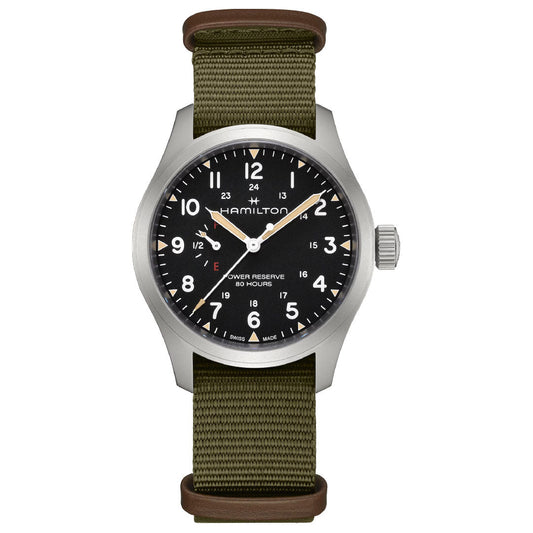 The Hamilton Khaki Field Mechanical Power Reserve 40mm Watch by Hamilton Watch features a black dial with white numerals, green fabric strap with brown leather accents, manual winding, 80-hour reserve, and 12/24-hour markings.