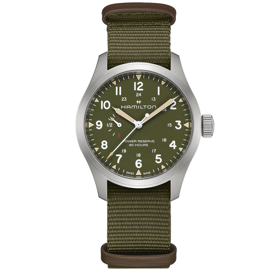 The Hamilton Khaki Field Power Reserve Mechanical 40mm by Hamilton Watch features a green dial, white Arabic numerals, silver hands, an olive fabric strap with brown leather accents, 24-hour time, and power reserve indicator.