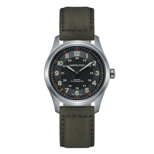 The Hamilton Khaki Aviation Pilot Pioneer Auto 38mm Watch showcases Hamilton Watch's rich aviation and military legacy with its black dial, dark green leather strap, and ability to display both 12-hour and 24-hour formats. Silver case accents are complemented by orange and white hour markers, while a prominent crown adds to the appeal of this automatic pilot watch.