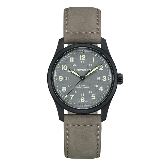 The Hamilton Watch Khaki Field Titanium Auto 38mm Watch features a black case and gray dial with white numerals and hands. Complemented by a beige leather strap, this military-inspired timepiece delivers a 24-hour display, embodying a classic design that is both rugged and refined.