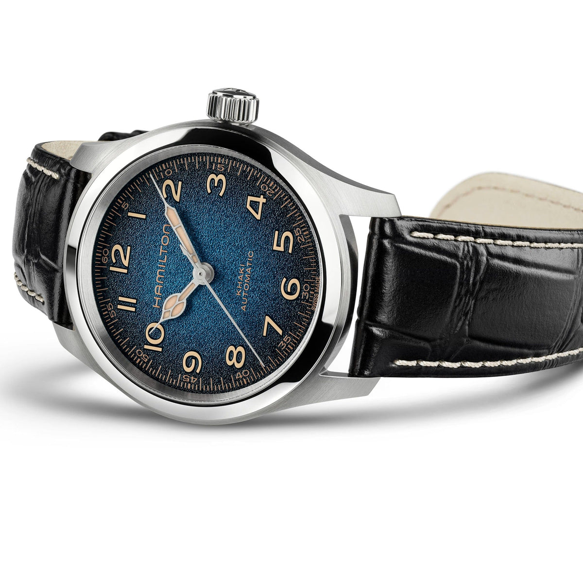Sure! Here’s a rewritten sentence using your product data: The Hamilton Khaki Field Murph Auto 38mm Watch by Hamilton Watch features a black leather strap with distinctive white stitching, a silver case, and an eye-catching blue-to-black dial accented by large bronze numerals. This wristwatch is powered by an automatic calibre movement and includes a prominent crown.