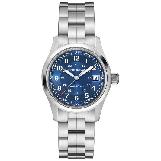 The Hamilton Khaki Field Auto 38mm Watch by Hamilton Watch features a stainless steel case, blue dial with white Arabic numerals, H-10 automatic movement, date at 3 o’clock, luminous hands and markers, and a silver metal bracelet.