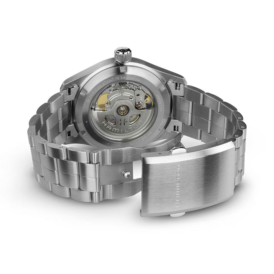 Back view of the Hamilton Khaki Field Auto 38mm Watch by Hamilton Watch, featuring an open clasp and a transparent case back that reveals the H-10 automatic movement—a tribute to its military-inspired design.