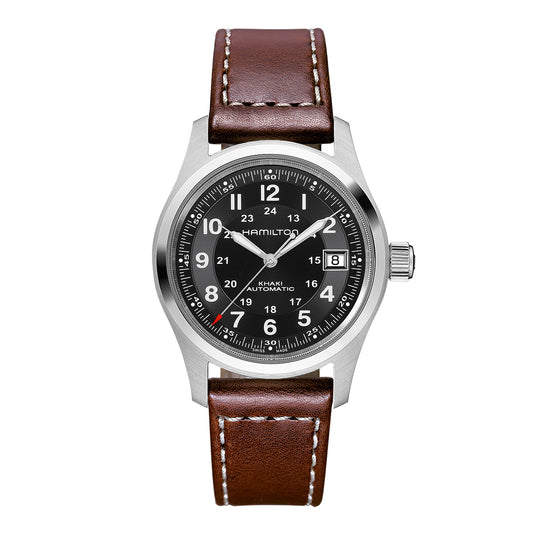 Introducing the Hamilton Khaki Field Auto 38mm Watch, a military-inspired silver wristwatch crafted by Hamilton Watch. It boasts a black dial with white markings and features both 12-hour and 24-hour numerals, complete with a date window positioned at 3 o'clock. The design is enhanced by a brown leather strap featuring white stitching, while the dial prominently displays the name "Hamilton".