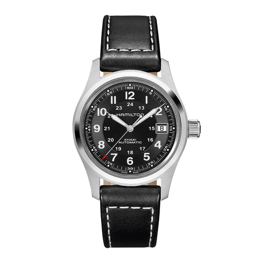 The Hamilton Khaki Field Auto 38mm Watch by Hamilton Watch features a black and silver design with a black leather strap. Its classic military-inspired aesthetics are highlighted by a black dial with white numerals, a date display at the 3 o'clock position, and luminous hands. This watch boasts an automatic caliber for superior power reserve.