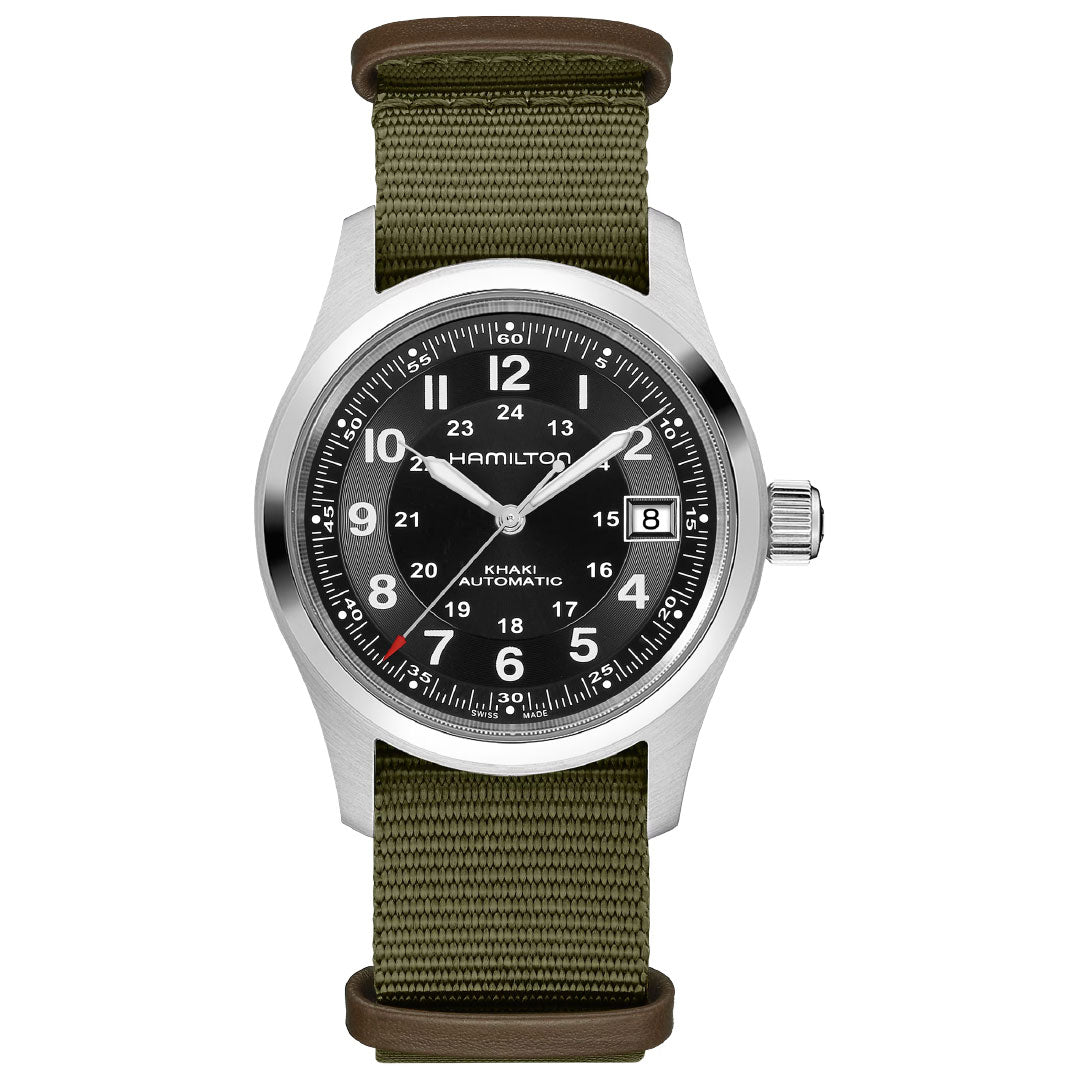 The Hamilton Khaki Field Auto 38mm Watch Call of Duty by Hamilton Watch features a black dial with white numerals, date window at 3 o’clock, silver case, and olive green nylon strap. Swiss-made.