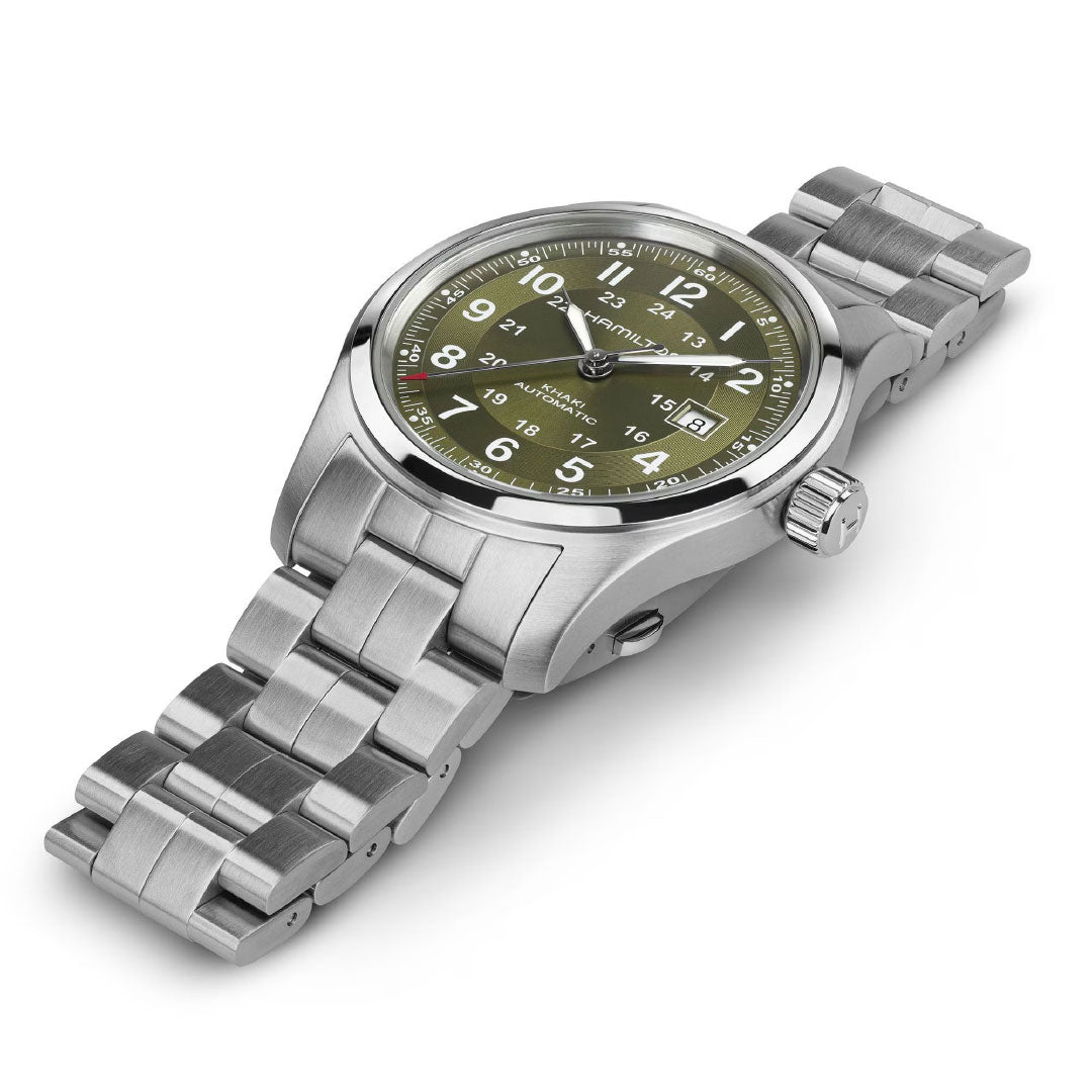 The Hamilton Khaki Field Auto 42mm Watch by Hamilton Watch features a stainless steel case, green dial with white Arabic numerals, date window, and metal link bracelet, displayed at an angle on a white background.