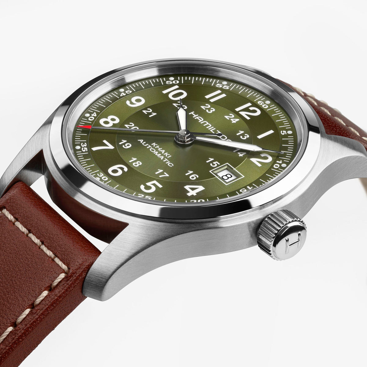 A close-up of the Hamilton Khaki Field Auto 42mm by Hamilton Watch, featuring a green dial with white numerals, date display, stainless steel case, and a brown leather strap with white stitching. This classic military-inspired timepiece shows the time as 10:09:36.