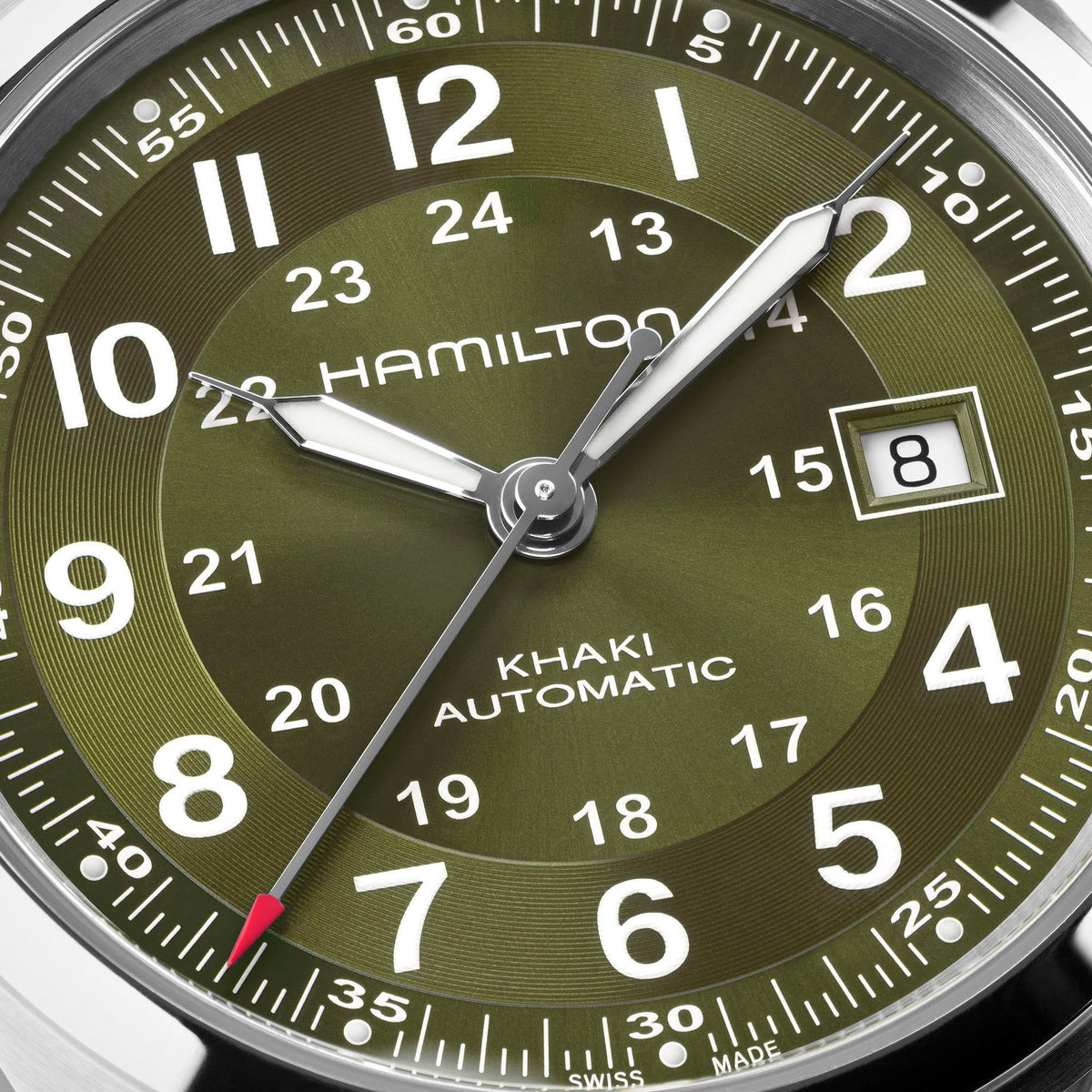 Close-up of the Hamilton Khaki Field Auto 42mm Watch by Hamilton Watch, featuring an olive green dial with silver hands, white numerals, a date window displaying the number 8, and a second hand accented with a red tip. This timepiece exemplifies the classic military aesthetic and robust automatic movement characteristic of Hamilton Watch.