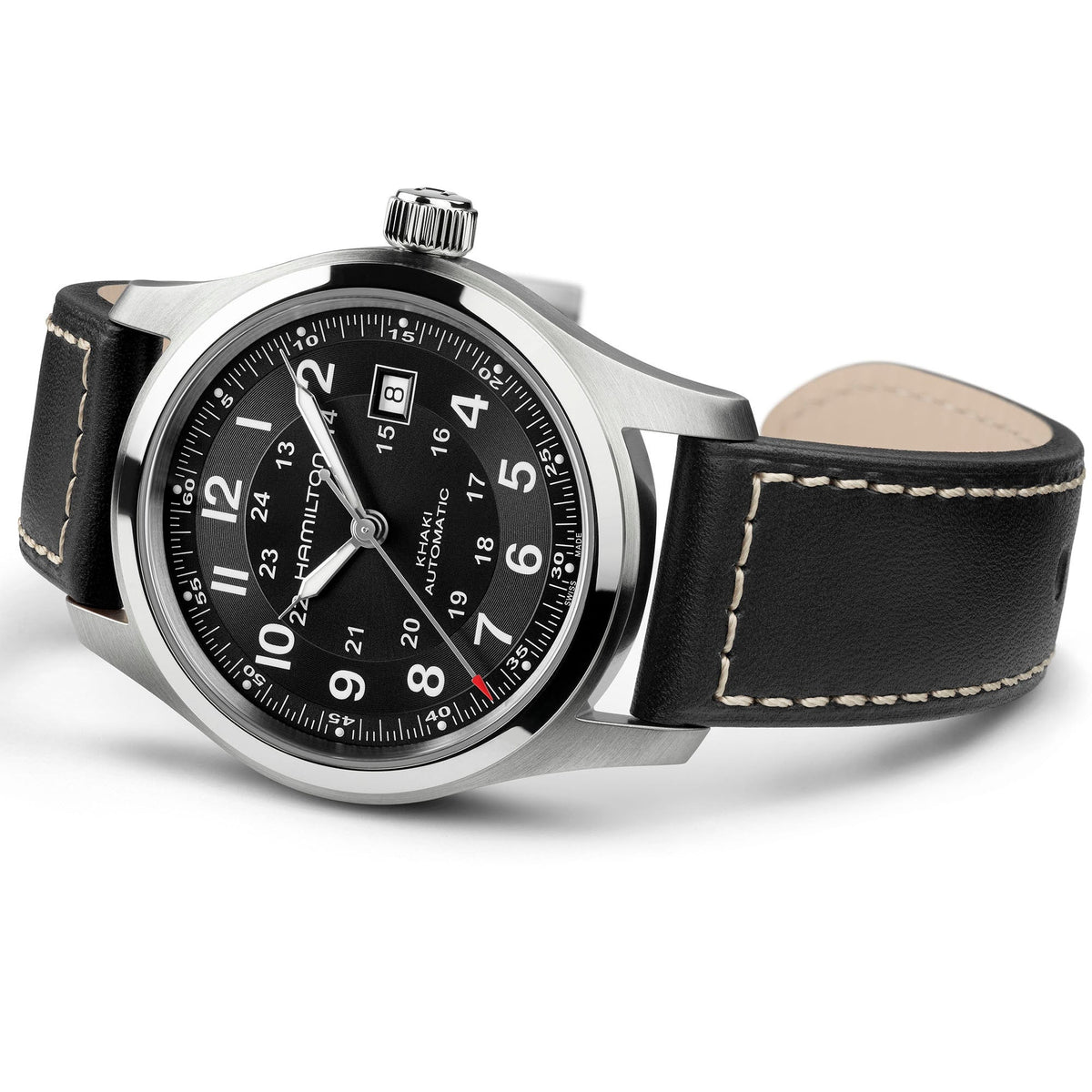 A Hamilton Watch Khaki Field Auto 42mm, featuring a black leather strap, black dial with white numerals, date display at 3 o’clock, and a silver case, is shown angled on a white background. Driven by an automatic calibre, this timepiece merges rugged reliability with timeless style.