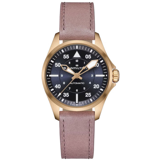 The Hamilton Khaki Aviation Pilot Auto 36mm Watch by Hamilton Watch boasts a khaki pilot style, featuring a brown leather strap, a gold case, and a black dial. Its white hour markers are complemented by larger numerals for the minutes, while silver hands glide seamlessly thanks to its automatic movement. Additionally, the tip of the second hand is adorned with an image of a small aircraft.