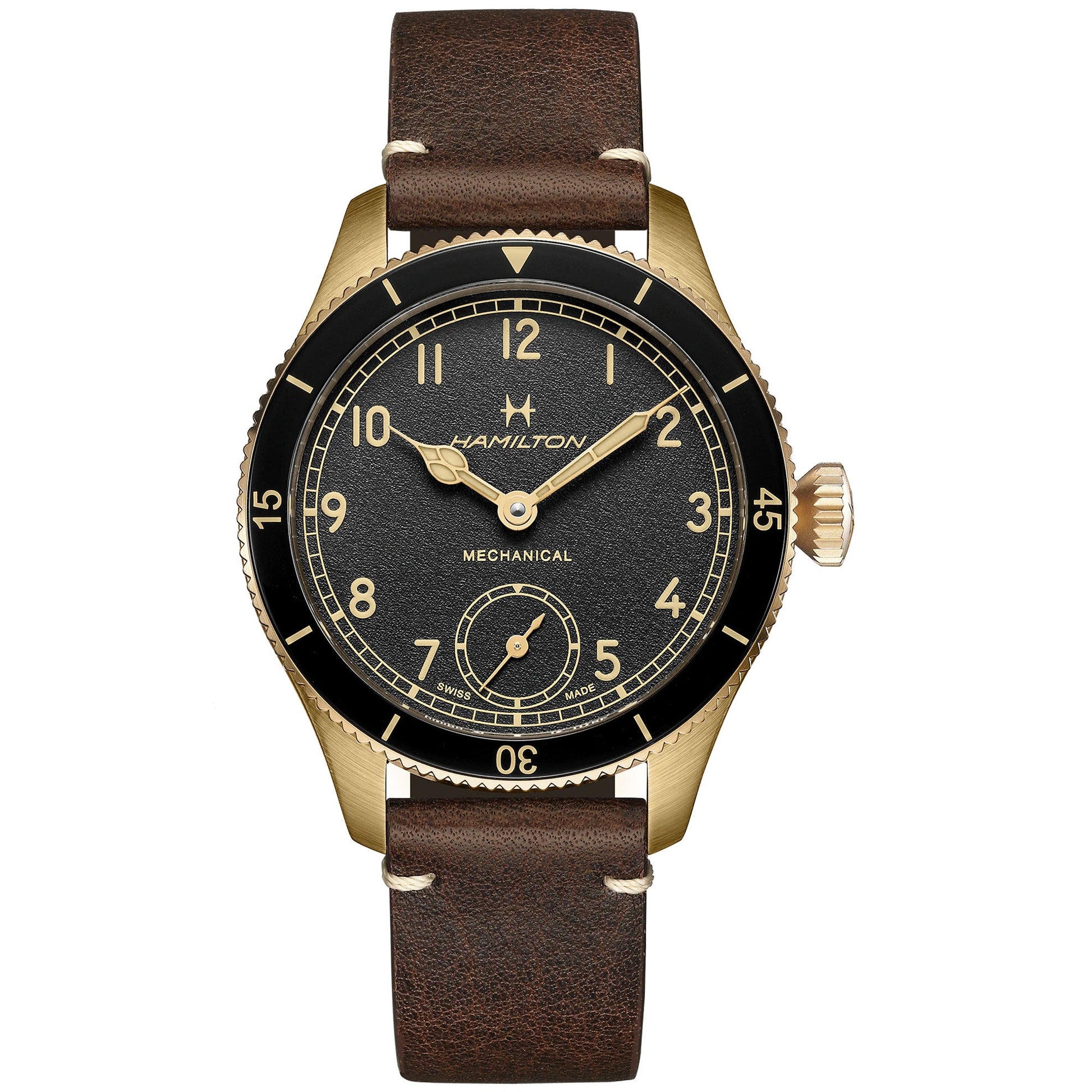 The Hamilton Khaki Aviation Pilot Pioneer Bronze Mechanical 43mm Watch by Hamilton Watch showcases a brown leather strap and features a black dial embellished with gold Arabic numerals. Gold hour and minute hands are complemented by a small seconds subdial positioned at 6 o'clock, while the beige bezel is intricately detailed with minute markings for accurate timekeeping.