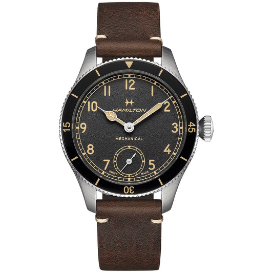 The Hamilton Khaki Aviation Pilot Pioneer Mechanical 43mm Watch by Hamilton Watch boasts a brown leather strap, a black dial with silver casing, and cream Arabic numerals. It highlights prominent luminescent hands and features a seconds subdial at six o'clock. Reflecting its aviation heritage, the dial is marked with "Mechanical.