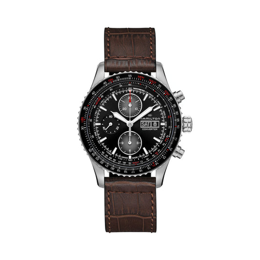 The Hamilton Khaki Aviation Converter Auto Chrono 44mm Watch by Hamilton Watch features a black dial with white markers and hands, complete with day and date displays. It boasts a silver case equipped with two pushers and a crown, complemented by a brown leather strap with a crocodile pattern.