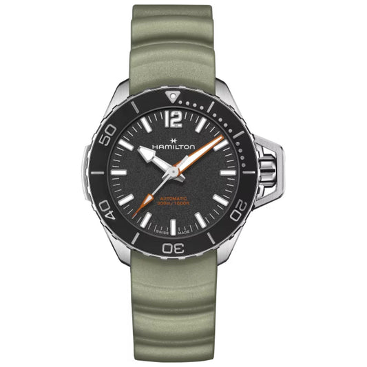 The Hamilton Khaki Navy Frogman Auto 41mm Watch by Hamilton Watch features a black dial with orange accents, a green rubber strap, a rotating bezel, and luminous hands and markers. It is water-resistant up to 300 meters.