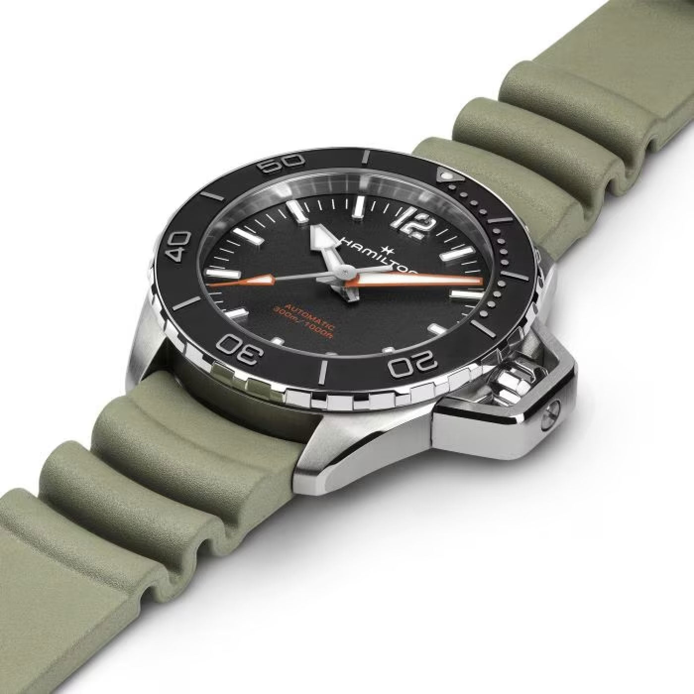 The Hamilton Khaki Navy Frogman Auto 41mm Watch by Hamilton Watch features a close-up view of its black dial with silver hour markers and a rotating bezel displaying minute indicators. The timepiece boasts a sleek metal case and an olive green rubber strap, while its watch hands are white with distinctive orange tips.