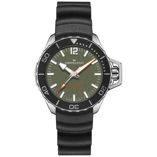 The Hamilton Khaki Navy Frogman Auto 41mm Watch by Hamilton Watch boasts a strong black rubber strap paired with an elegant stainless steel case. Its eye-catching green dial is enhanced by white hour markers and hands featuring vivid orange accents. A practical bezel presents minute markings, and the crown is thoughtfully placed on the right side.