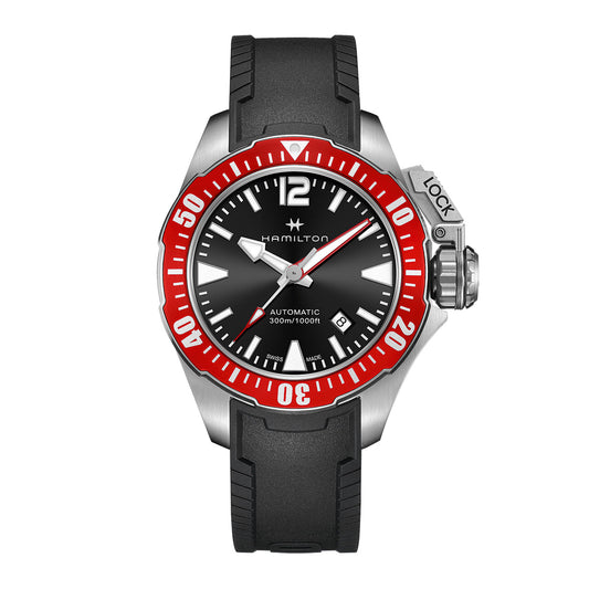 The Hamilton Khaki Navy Frogman Auto 42mm Watch by Hamilton Watch features a striking black and red bezel and an elegant black dial. It boasts a silver case, H-10 automatic movement, water resistance, and a robust black rubber strap, complete with a secure crown lock mechanism for enhanced protection.