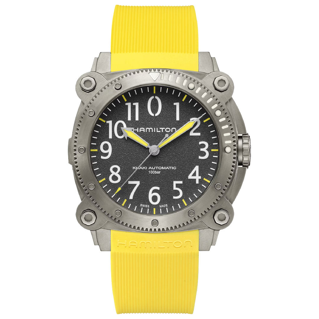 The Hamilton Khaki Navy BeLow Zero Auto Titanium 46mm watch features a round gray case, black dial with white numerals, yellow hands, yellow textured rubber strap, and is water resistant up to 100 meters.