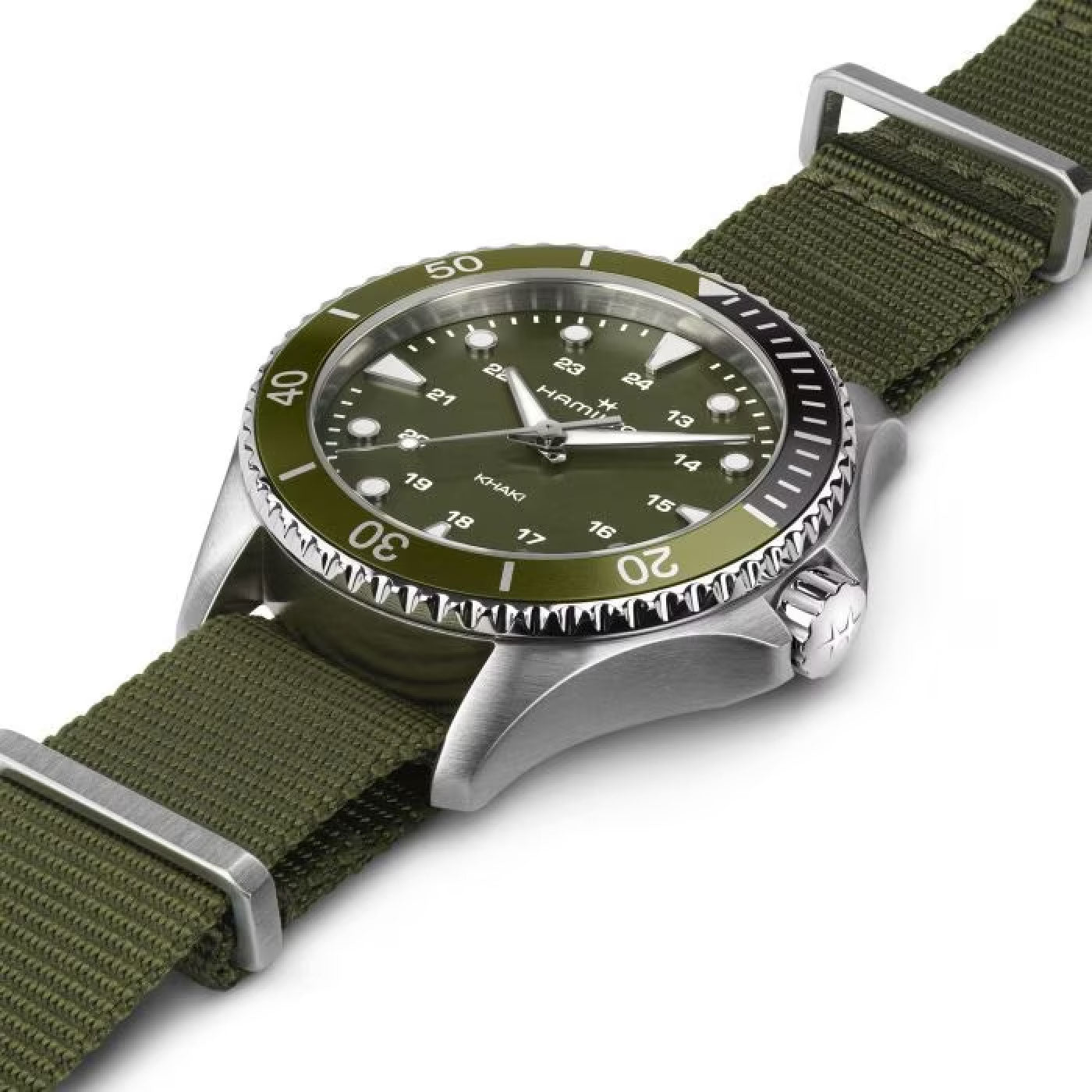 Presenting the Hamilton Khaki Navy Scuba Quartz 37mm Watch by Hamilton Watch, featuring a vibrant green dial encased in a silver bezel and paired with a coordinating green nylon strap. The face includes white hour markers, hands, and a date window. Its textured crown accentuates the rugged yet sporty design, making it an ideal choice for adventurous individuals who prioritize both style and functionality.