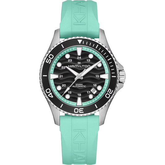 The Hamilton Watch Khaki Navy Scuba Auto 40mm features a teal rubber strap, black and silver bezel, black textured dial with white numerals, and luminous hands and markers, shown on a white background.