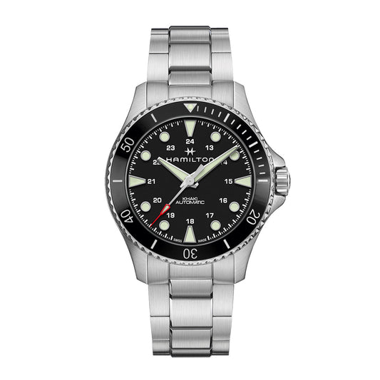 The Hamilton Khaki Navy Scuba Auto 43mm Watch showcases a stainless steel wristwatch with a black circular dial that highlights luminous hands and markers. The bezel is detailed with minute increments, and the brand name "Hamilton Watch" is elegantly displayed. It features a metal bracelet and boasts a classic diver-style design.