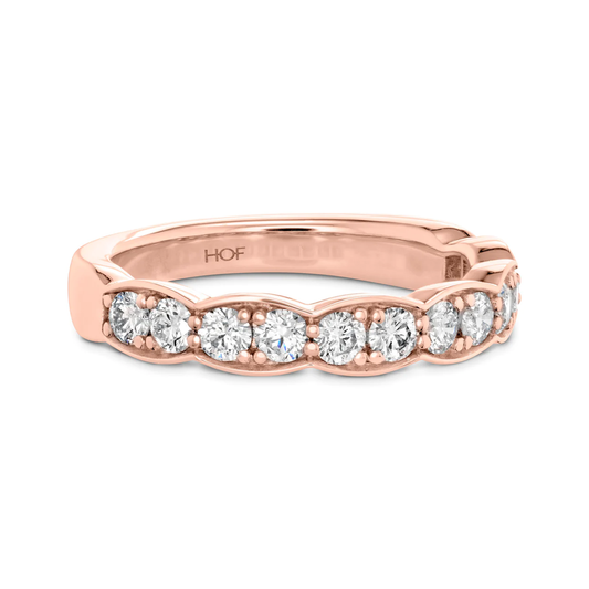 The Hearts On Fire 18K Rose Gold Round Brilliant Diamond Anniversary Ring by Hearts on Fire showcases a timeless and luxurious design with its round, sparkling diamonds adorning the band.