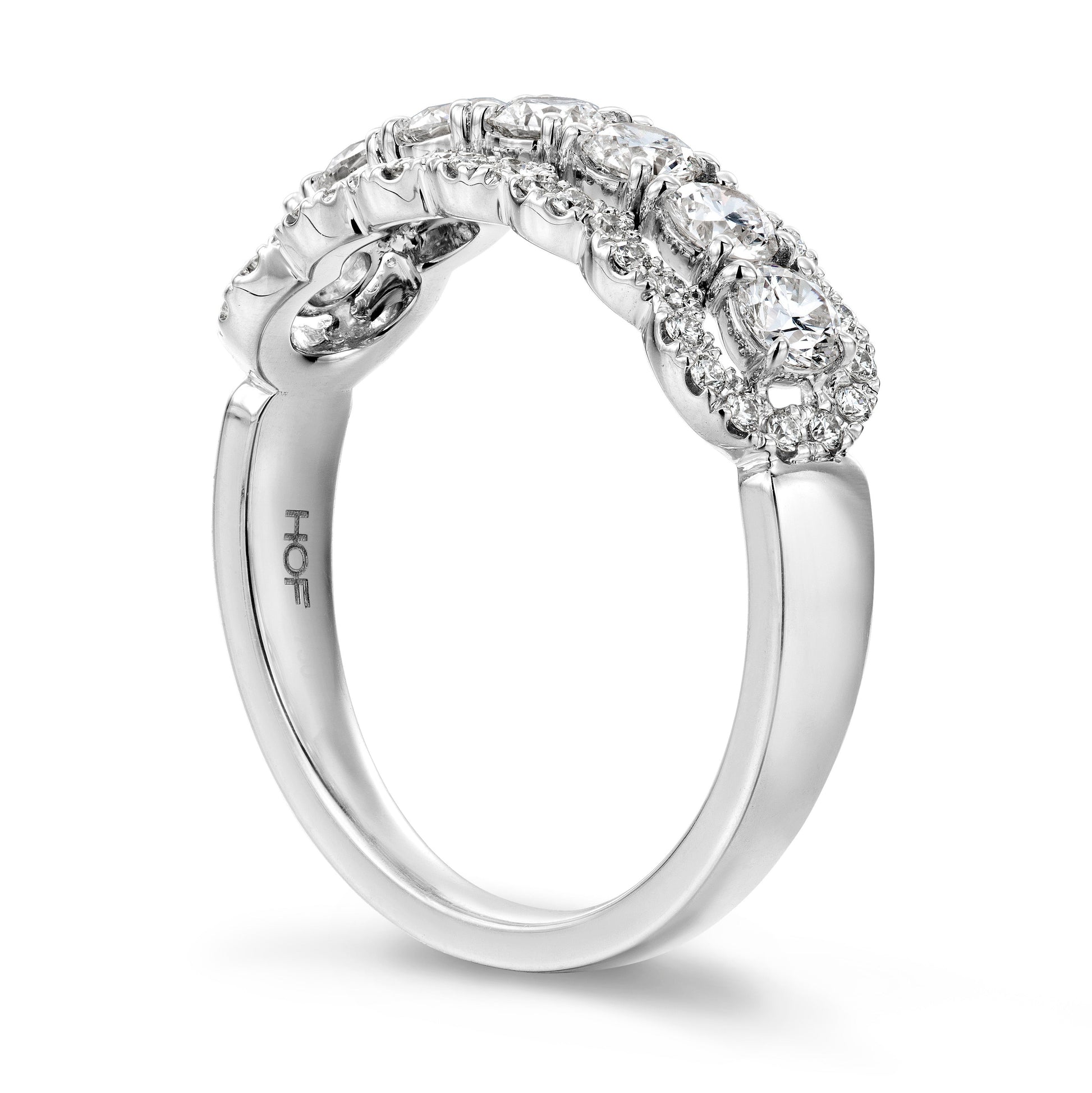 Introducing the Hearts On Fire Aurora 18K White Gold Round Brilliant Diamond Fashion Ring from Hearts on Fire. This exquisite silver ring features intricate detailing and a row of sparkling round brilliant diamonds. The band, crafted from 18 Karat white gold, boasts a smooth and polished finish that radiates elegance.