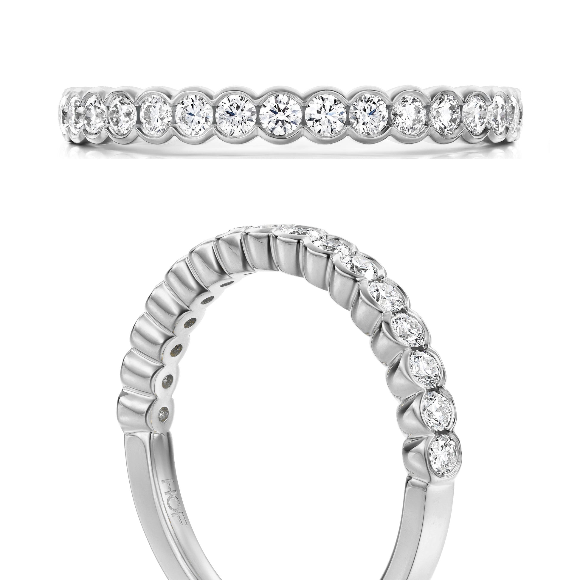 Presenting the exquisite Hearts On Fire Isabelle 18K White Gold Bezel Round Brilliant Diamond Anniversary Ring, crafted with exquisite precision by Hearts on Fire. This elegant piece showcases a continuous design of white diamonds in bezel settings encircling the band. Displayed from a side and angled top view, this ring exemplifies exceptional craftsmanship—perfect for marking your special day.
