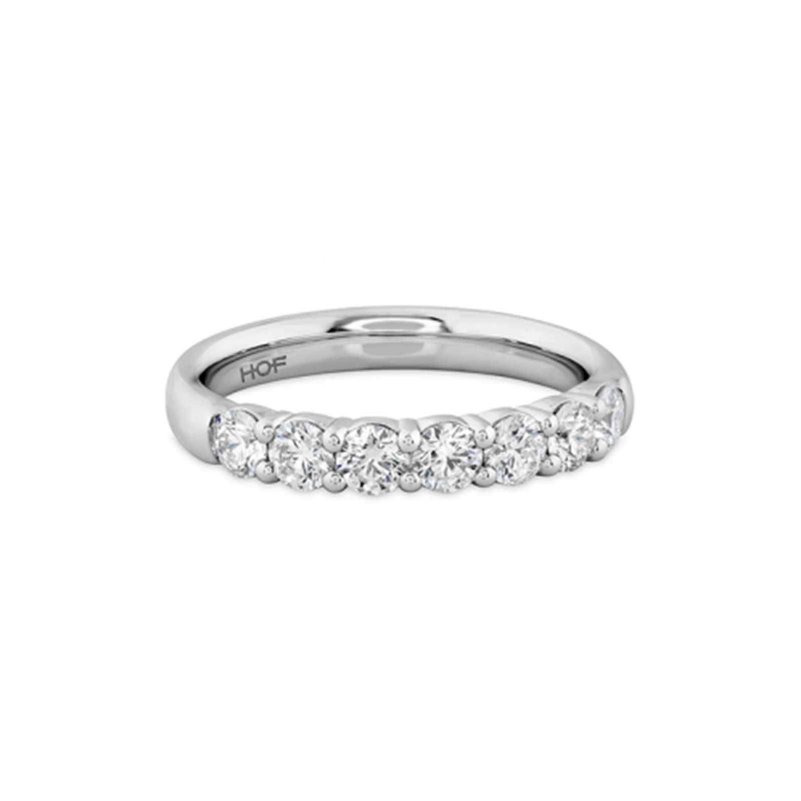 The Hearts On Fire Signature 18K White Gold Round Brilliant Diamond Anniversary Ring is crafted in 18 Karat white gold and adorned with a row of dazzling round diamonds set elegantly along the band.