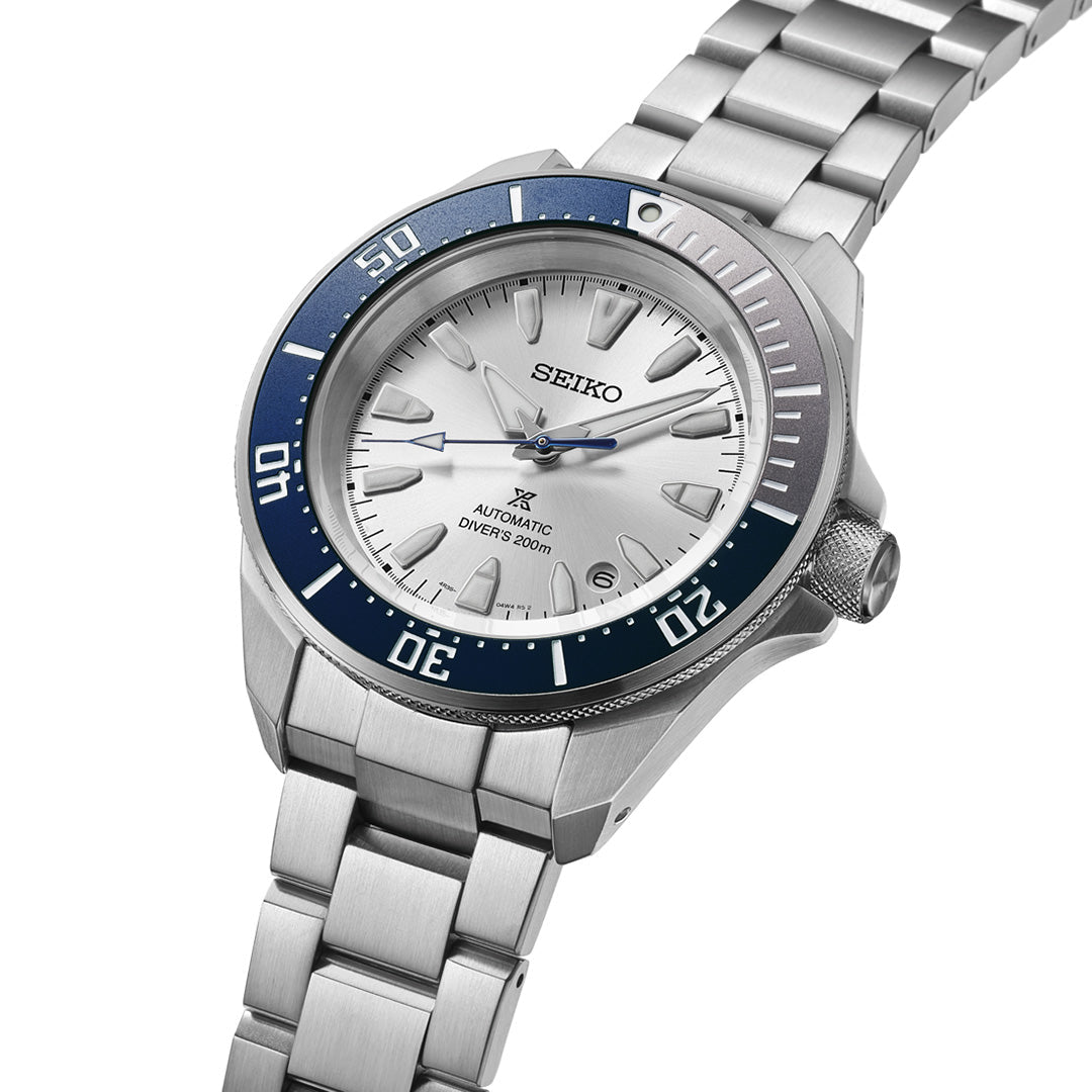Introducing the Seiko Prospex Sea 145th Anniversary Limited Edition Automatic watch, showcasing a 41.7mm case, silver dial, eye-catching blue and silver bezel, and a robust stainless steel bracelet. The dial is adorned with the “Seiko,” “Automatic,” and “Diver’s 200m” markings.