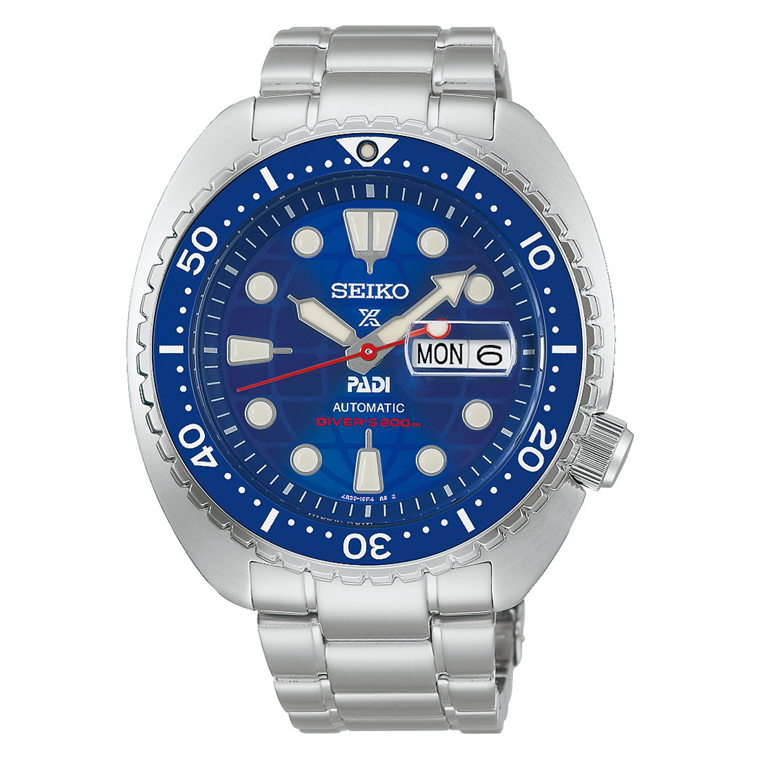 The Seiko Prospex Sea 60th Anniversary Limited Edition Automatic 45mm Watch PADI by Seiko boasts a bold blue dial with silver hour markers, a day and date display, and is crafted with a durable 45mm stainless steel case complemented by a matching silver metal bracelet. Its blue bezel features sharp white markings, highlighting the exceptional craftsmanship of this limited edition automatic timepiece.