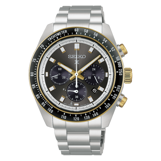 Seiko Prospex Speedtimer Solar Chronograph 41.4mm Watch with a silver-tone metal link bracelet, a dark grey dial with three sub-dials, and a black and gold tachymeter bezel.
