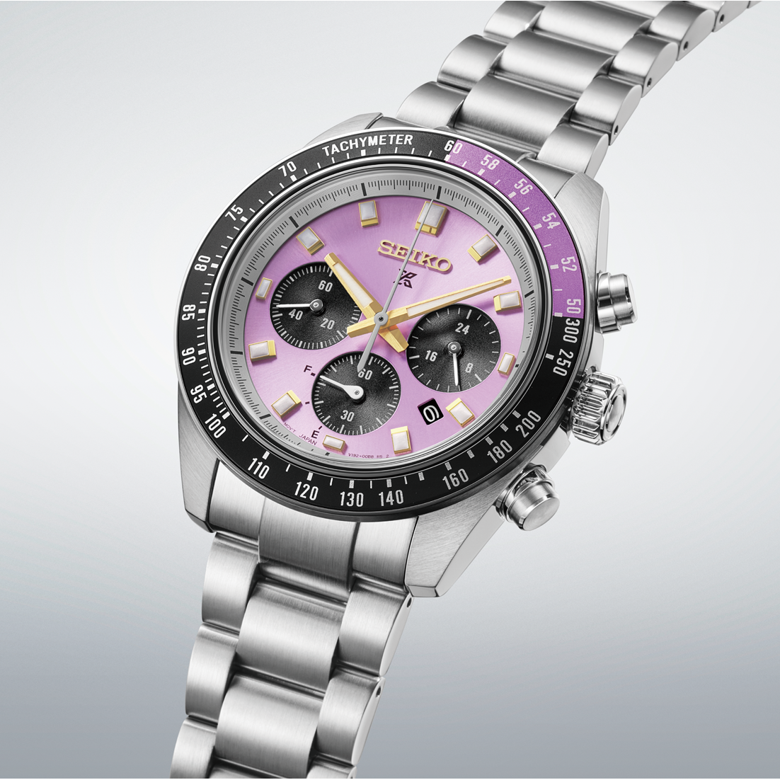 Seiko Prospex Speedtimer Solar Chronograph 41.4mm Watch in Edo purple with a metallic dial, three black subdials, gold hands, and a black tachymeter bezel on a stainless steel link bracelet.