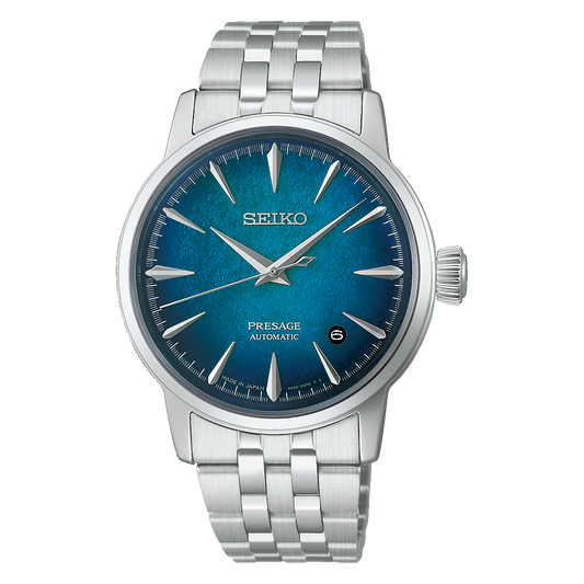 Seiko Presage Cocktail Time Automatic With Manual Winding 38.5mm watch with an analog display, a textured blue dial, silver indices, and a silver link bracelet.