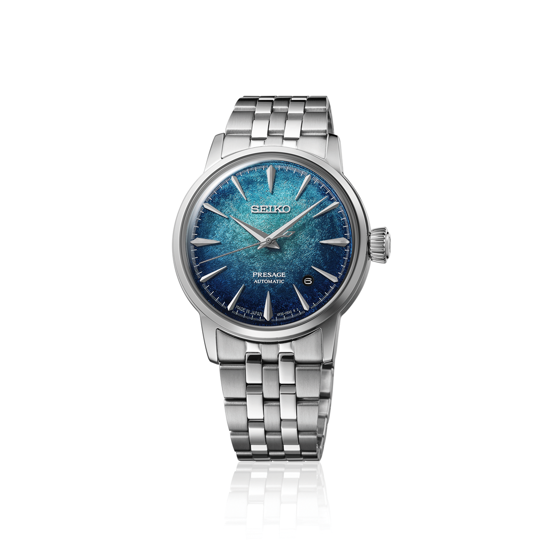 Seiko Presage Cocktail Time Automatic With Manual Winding 38.5mm watch featuring a silver metal link bracelet and a textured blue dial with silver hands, hour markers, and a date window.