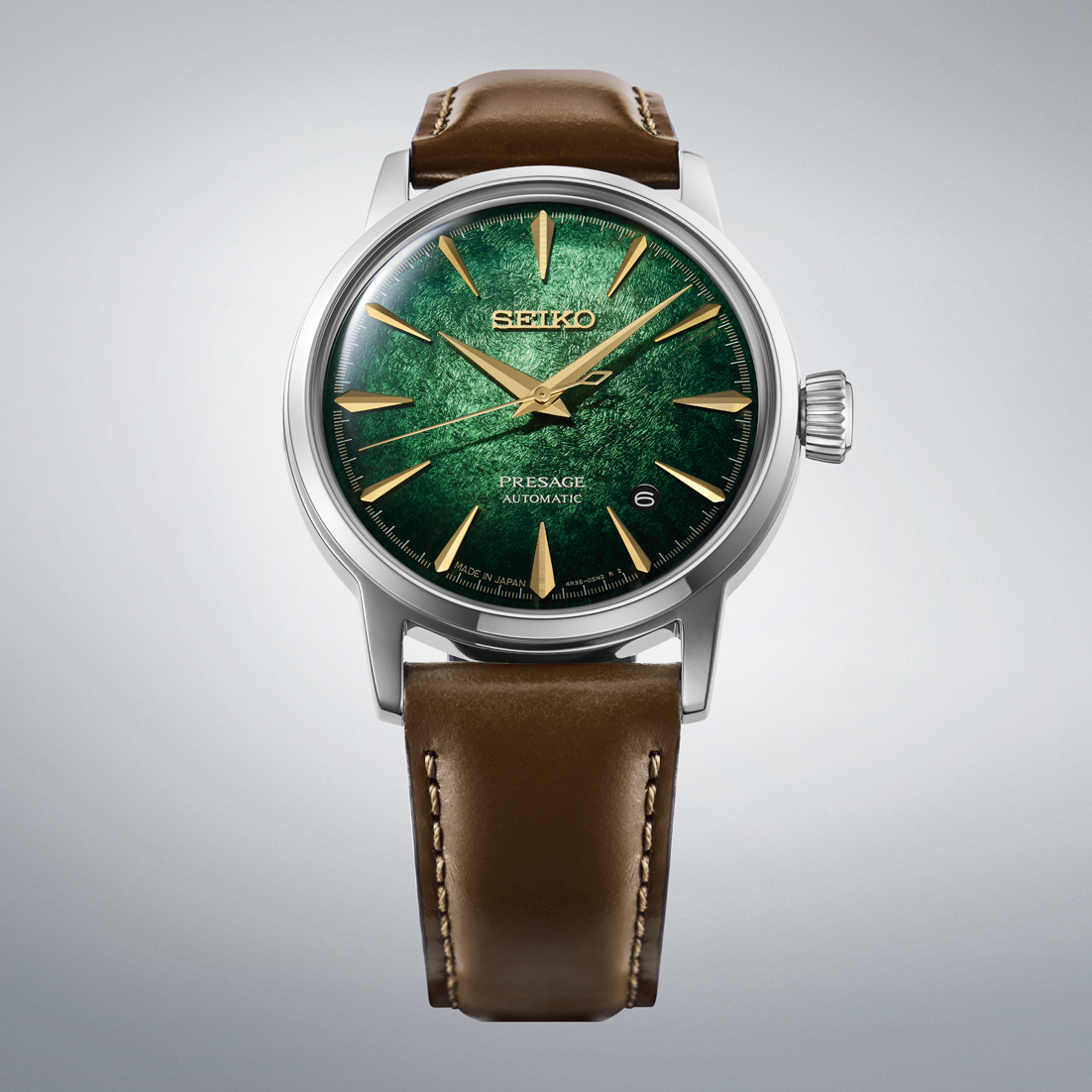 Seiko Presage Cocktail Time Automatic With Manual Winding 38.5mm watch featuring a textured emerald green dial, gold indices, and a brown leather strap.