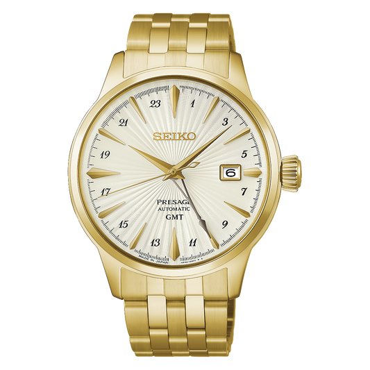 Gold-tone Seiko Presage Cocktail Time GMT Automatic With Manual Winding 40.5mm Watch with a textured off-white dial, gold hands, index markers, a 24-hour scale, and a metal link bracelet.