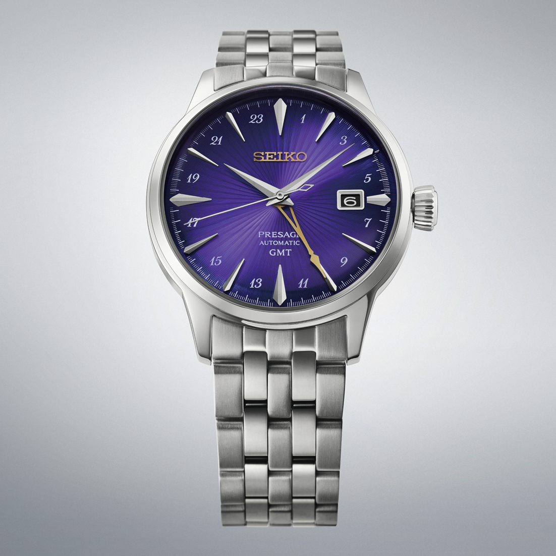 Seiko Presage Cocktail Time GMT 145th Anniversary Limited Edition Automatic With Manual Winding 40.5mm Watch featuring a metal link bracelet, a deep purple sunray dial with silver indices, and a gold GMT hand.