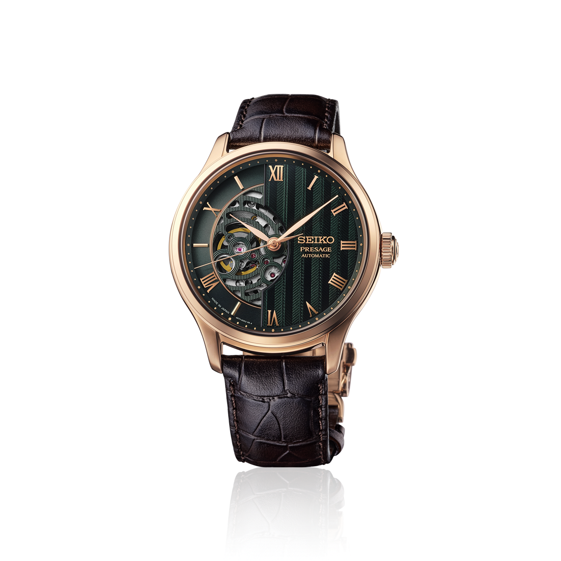 Seiko Presage Japanese Garden Open Heart Automatic With Manual Winding 41.8mm watch in rose gold with a dark green dial featuring an open-heart aperture and a brown leather strap.