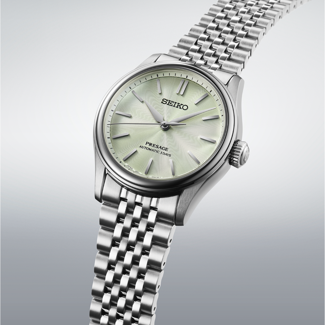 Seiko Presage Classic Series Automatic With Manual Winding 38mm watch featuring a light green sunray dial and a silver-tone multi-link metal bracelet.