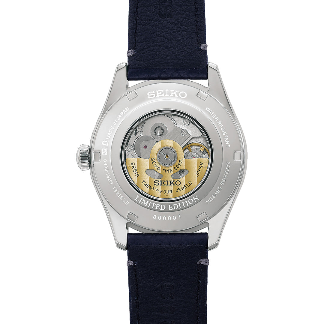 Close-up of the back of a Seiko Presage Classic Series 145th Anniversary Automatic 39.6mm Watch, Limited Edition of 1,500 pieces, featuring a transparent caseback that reveals the automatic movement, marked “LIMITED EDITION,” and paired with a dark strap.