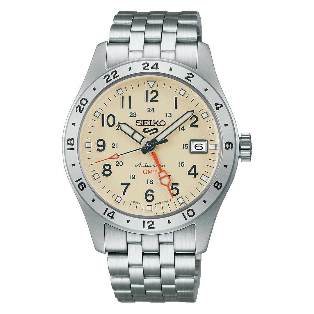 The Seiko 5 Sports Field Series GMT Automatic 39.3mm Watch by Seiko features a beige dial, stainless steel band, black hour markers, a date window at 3 o’clock, and a red GMT hand for tracking a second time zone—blending practical functionality with classic style.