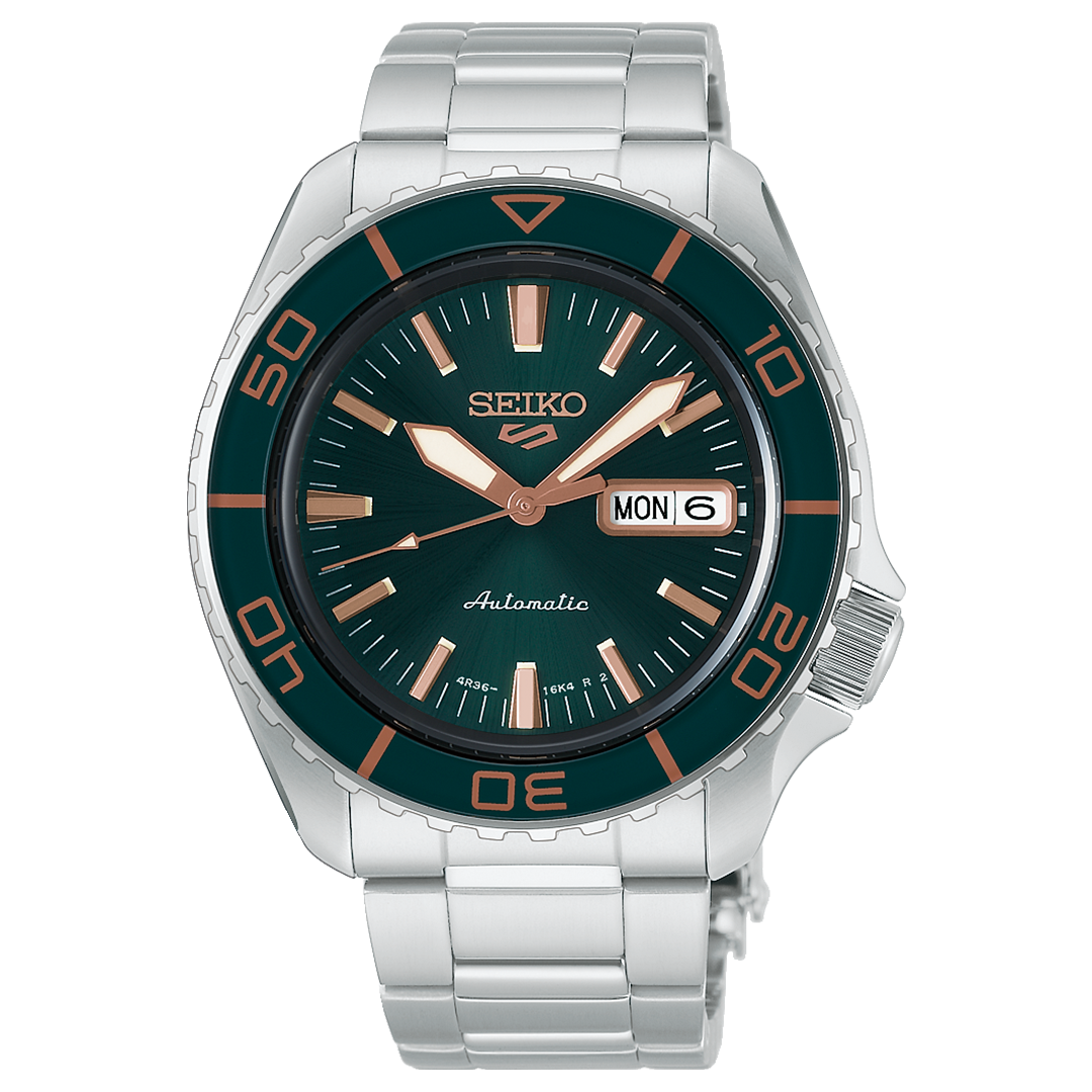 Seiko 5 Sports SKX Series Automatic 42.5mm Watch with a dark green dial, copper-colored indices and hands, a rotating bezel, and a silver stainless steel bracelet.