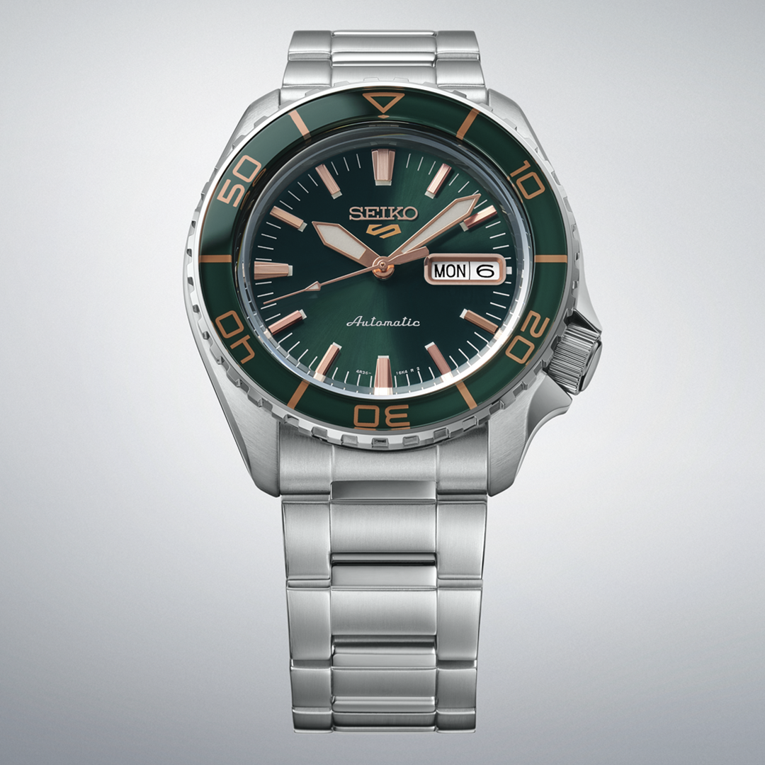 Seiko 5 Sports SKX Series Automatic 42.5mm Watch with a green dial, rotating bezel, and silver-tone metal link bracelet.